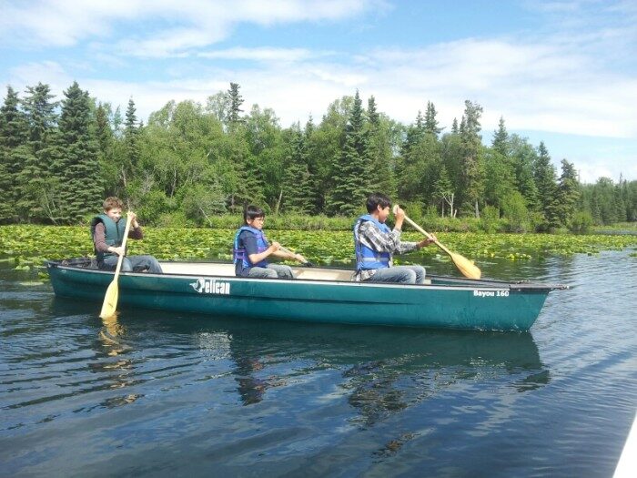 boys-in-canoe-2-700x525-8397314